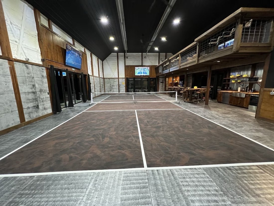 Indoor pickleball barn court with vaulted ceiling