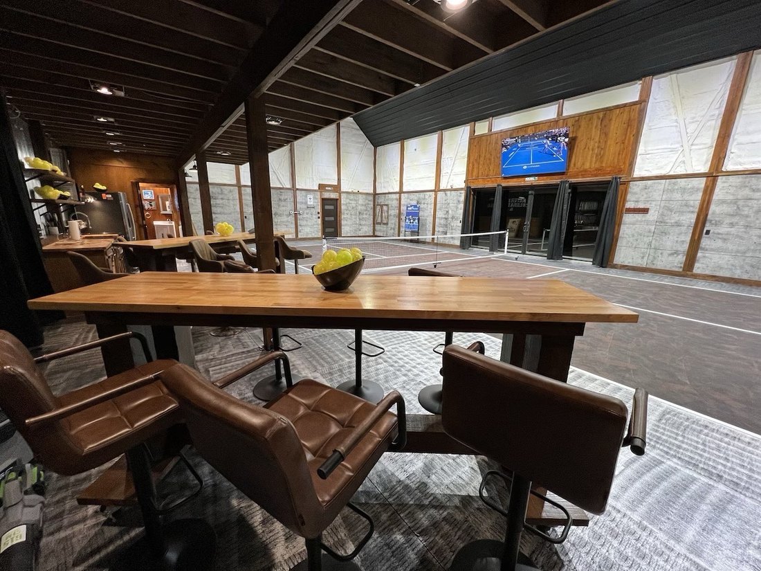 Indoor pickleball court clubhouse seating